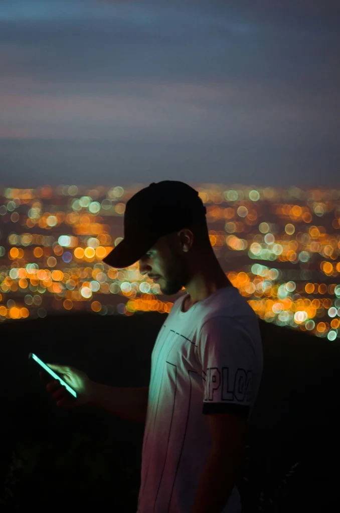Photo of man looking at photos of his estranged dad that is non-death grief